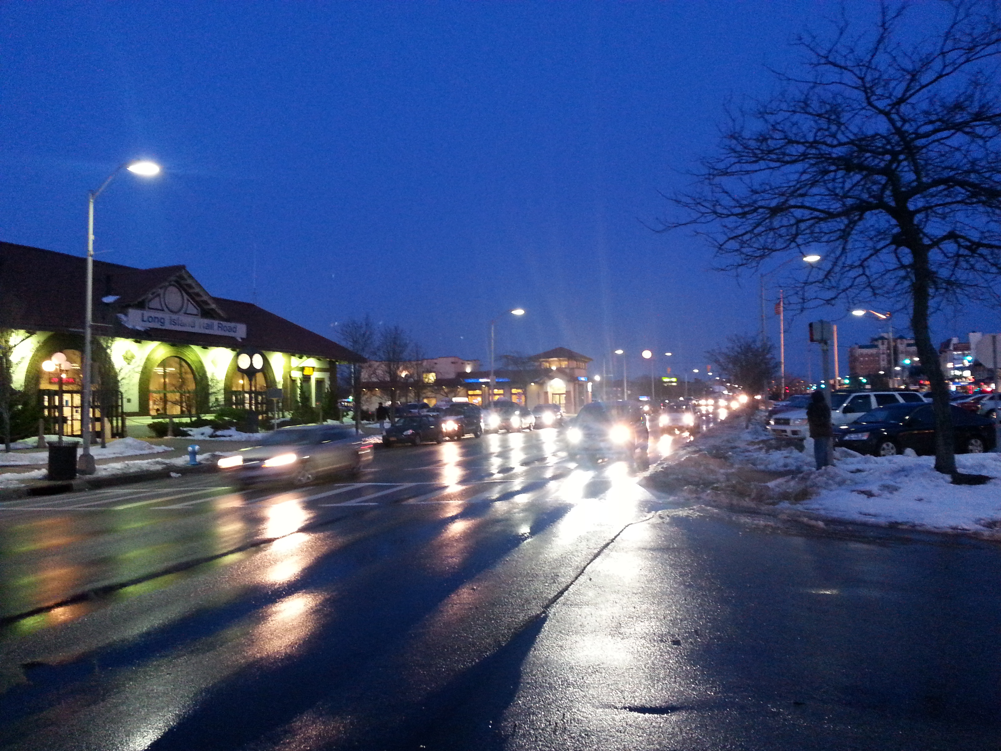 A busy street block at nighttime